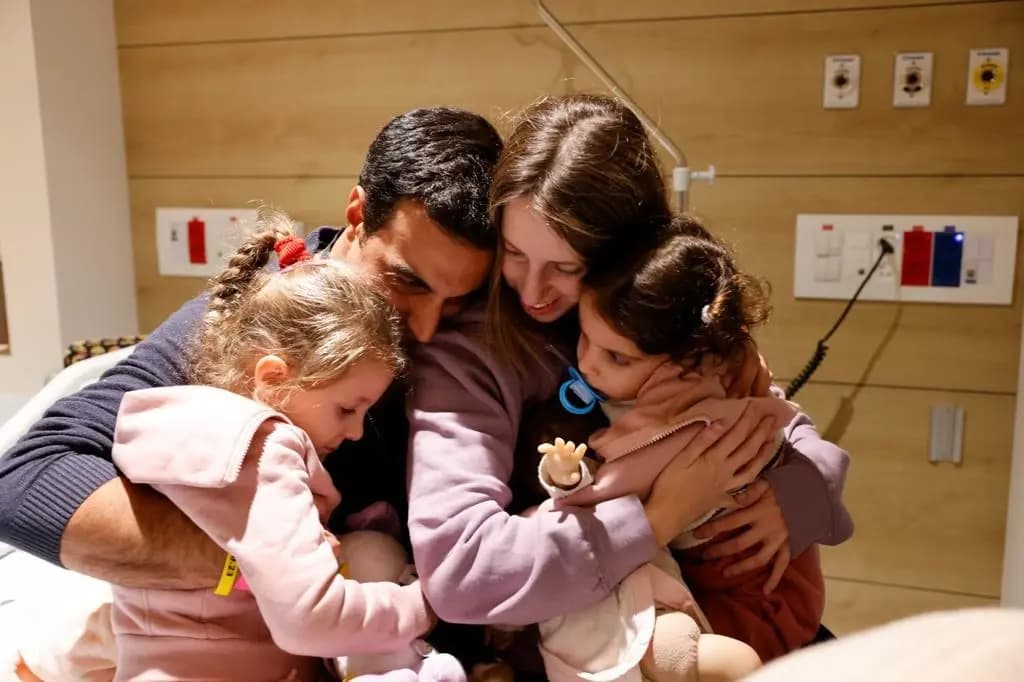 Doron Katz-Asher and her family after being freed from captivity Doron Katz-Asher and her family after being freed from captivity