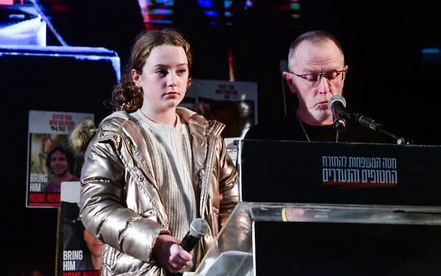 Former hostage Emily Hand with her father