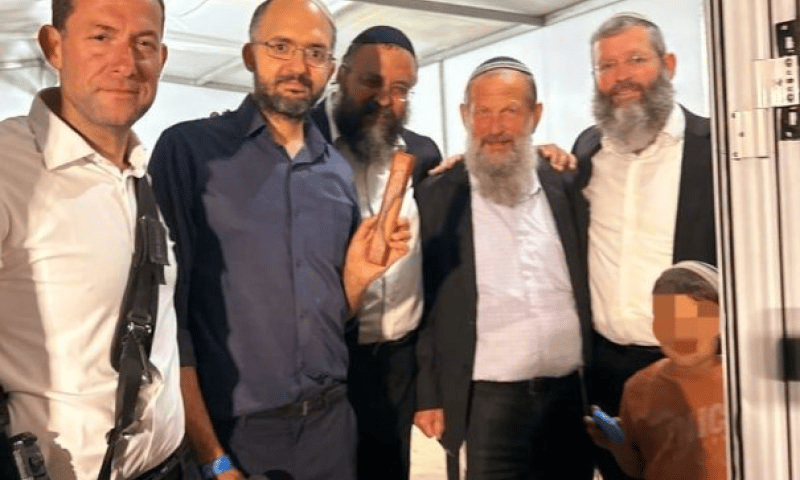 Hananel Gez affixing the mezuzah in memory of his late wife Tse'ela Gez HY'D