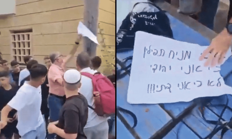 Teacher ripping off a sign saying "I lay tefillin because I'm a Jew, not becasue I'm religious"