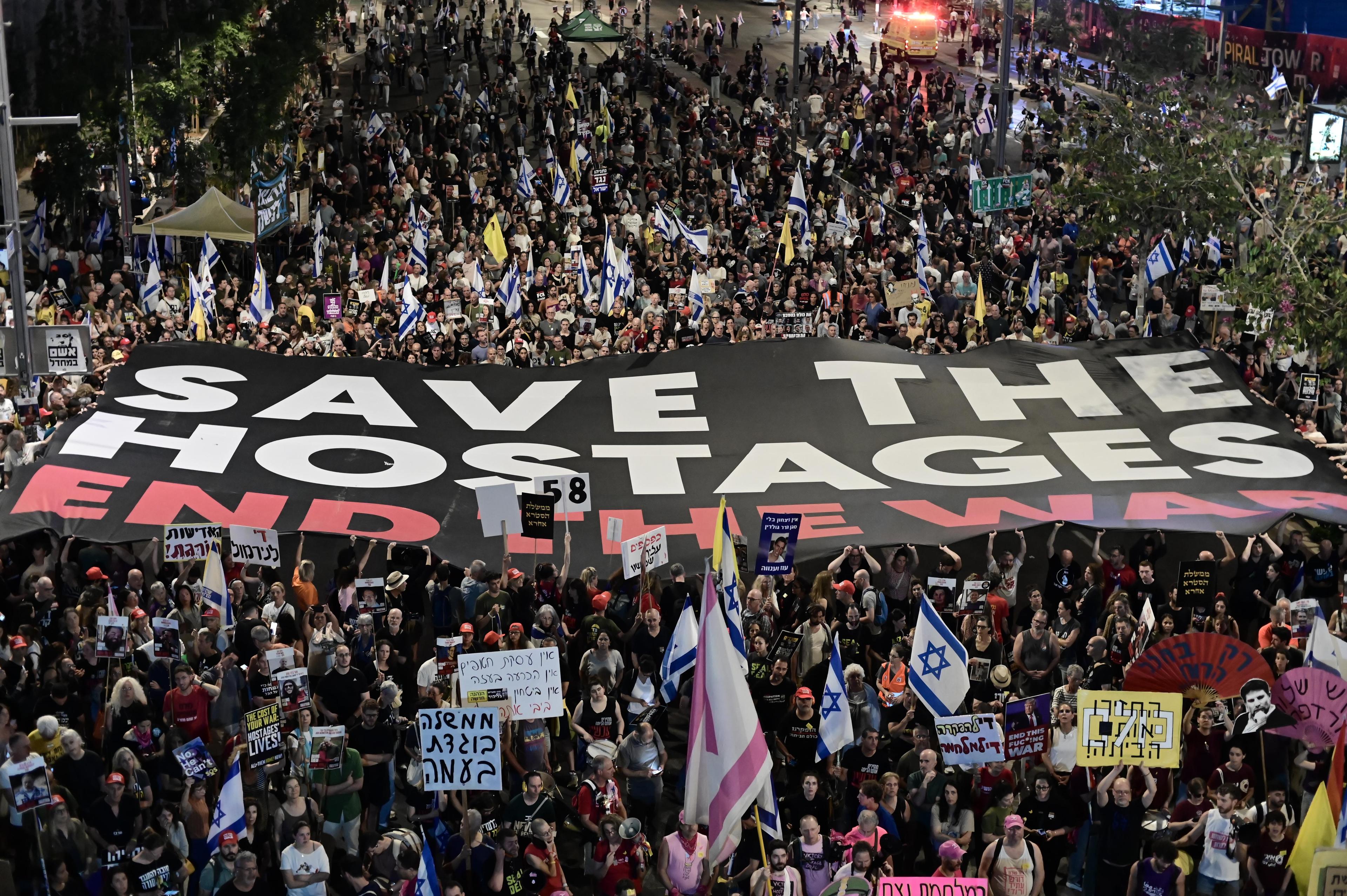 Demonstrators protest against the Israeli government and for the release of Israelis held hostage in the Gaza Strip outside Hakirya Base in Tel Aviv, May 24, 2025. 