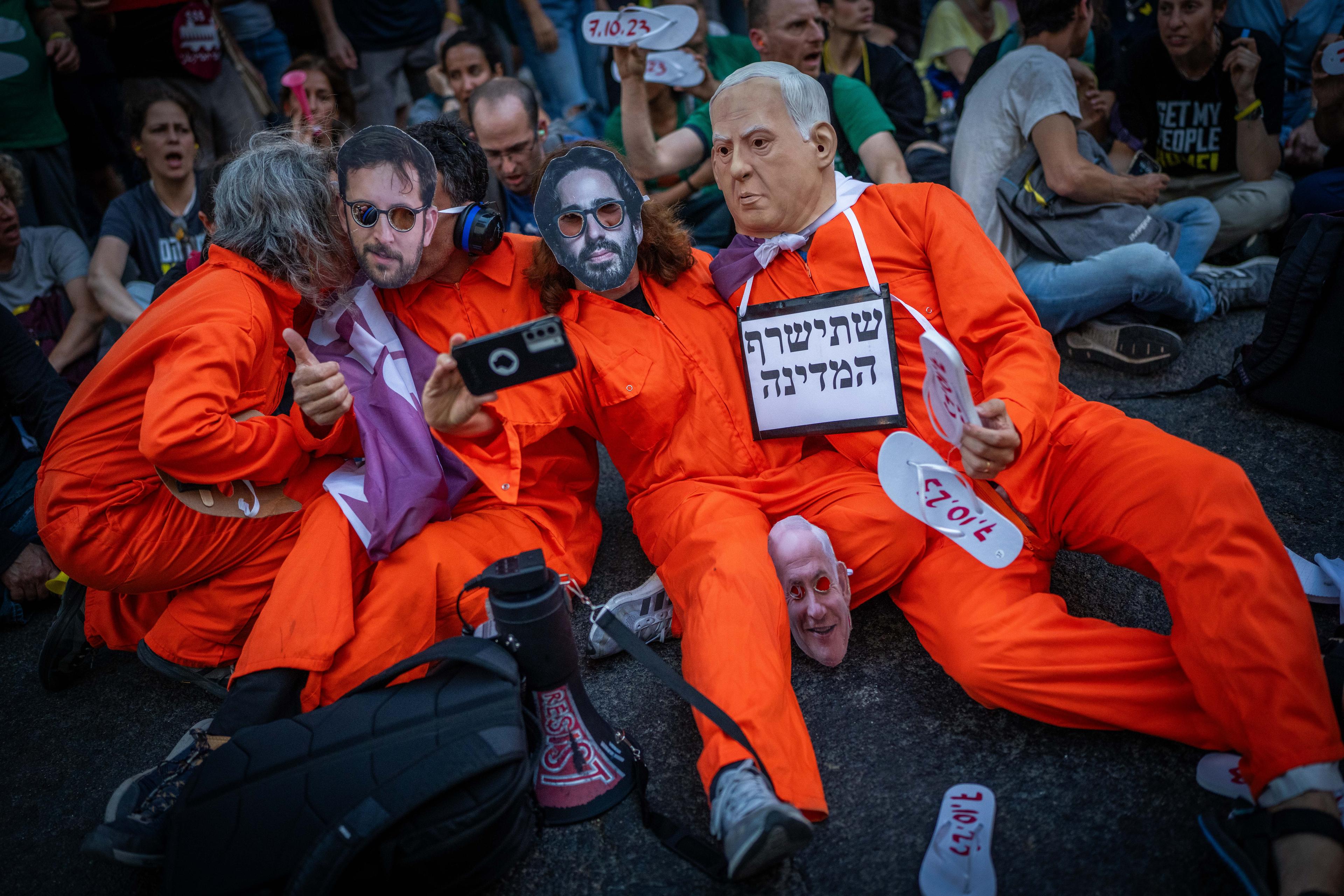 Demonstrators protest against the Israeli government and for the release of Israelis held hostage in the Gaza Strip, outside the Likud headquarters in Tel Aviv, May 28, 2025. 