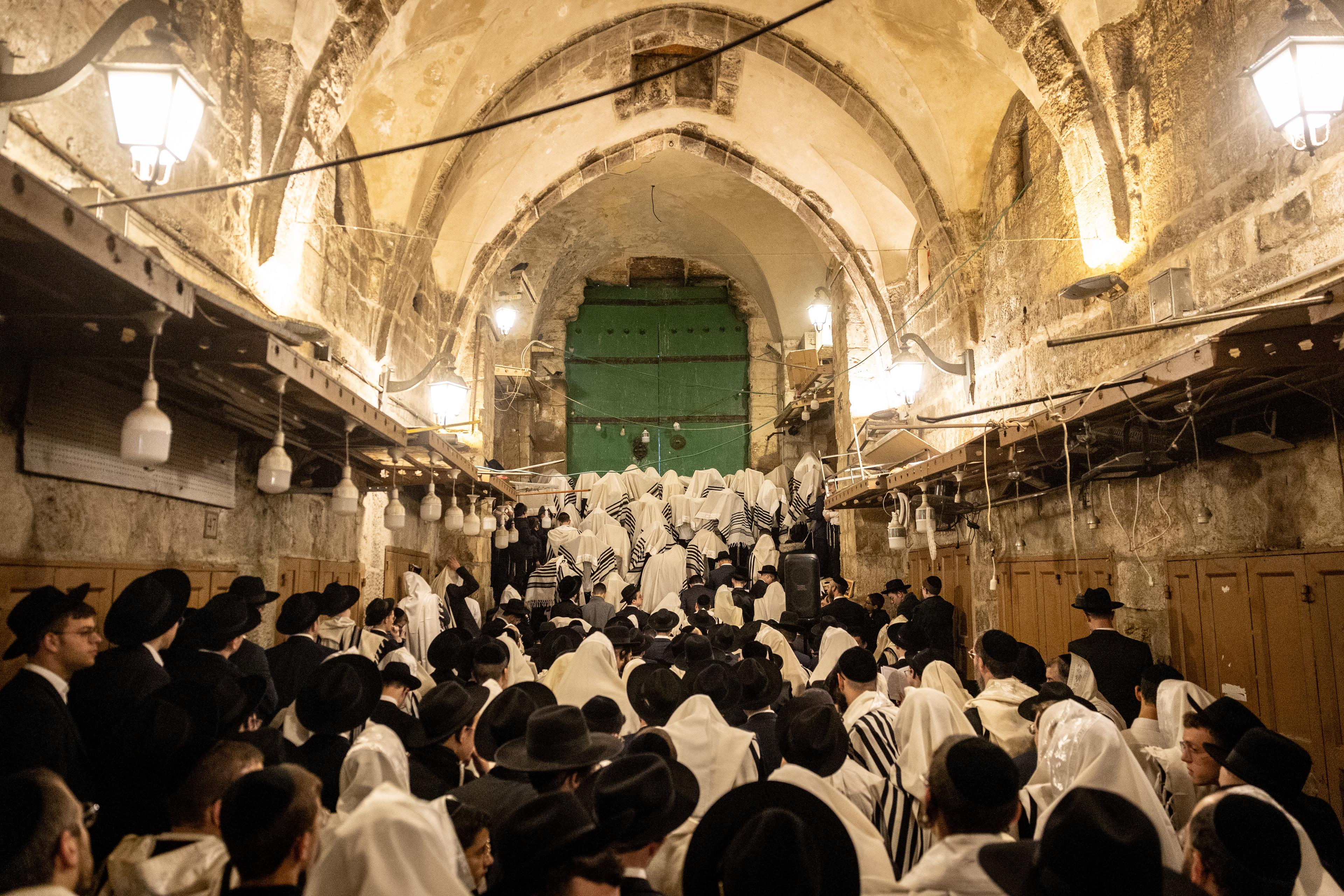 Orthodox Jews pray outside the al-Aqsa compound, also known to Jews as the Temple Mount, in the Muslim quarters of Jerusalem's Old City during the Passover holiday. April 15, 2025. 