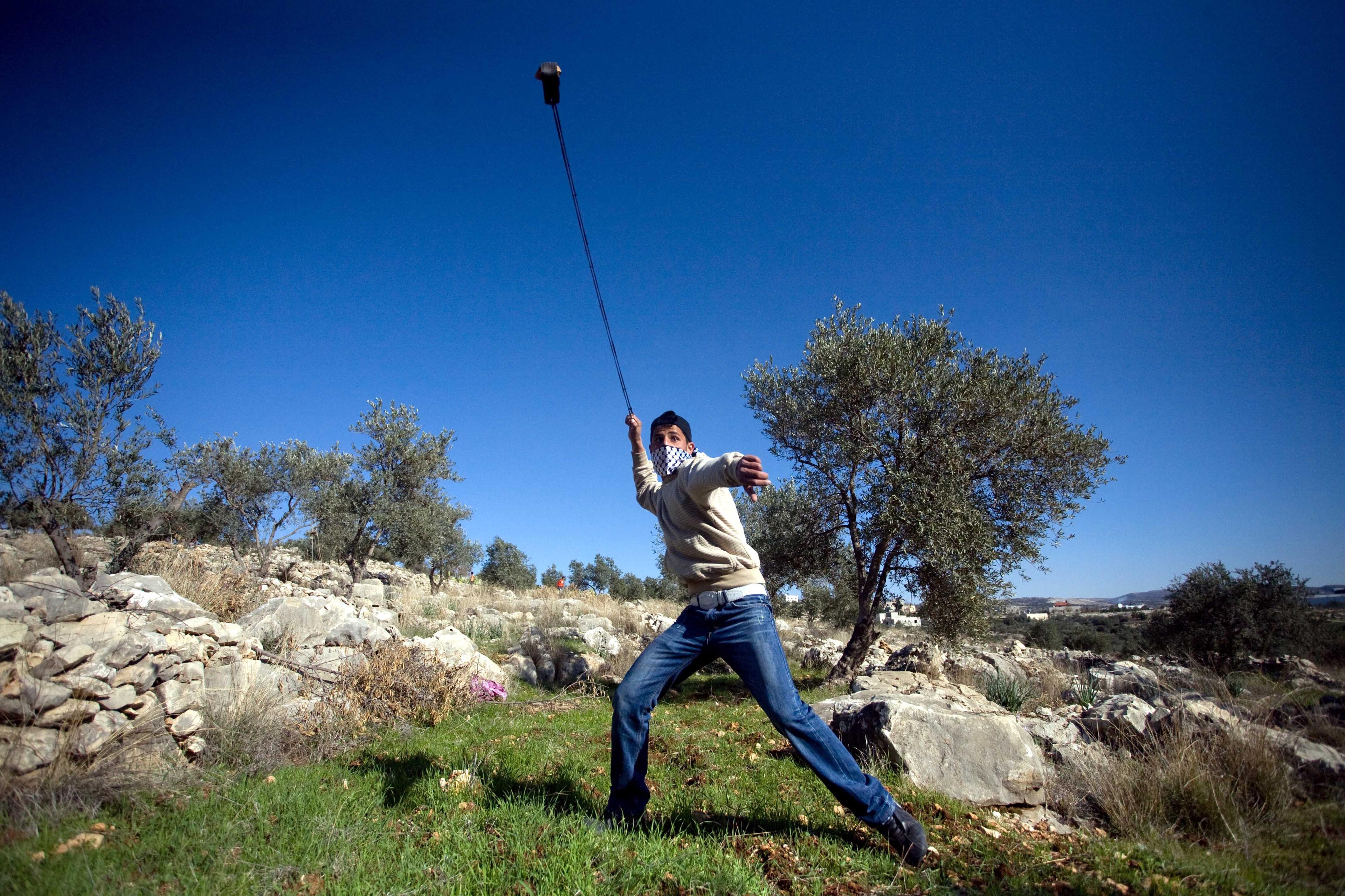 Palestinians throwing stones. Illustration. Palestinians throwing stones. Illustration.