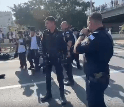 Police overseeing protest on Road 4. Police overseeing protest on Road 4.