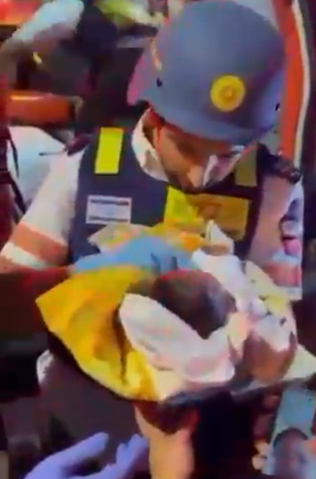 Magen David Adom Medics rescue 6 day old baby from the rubble after the Iran attack