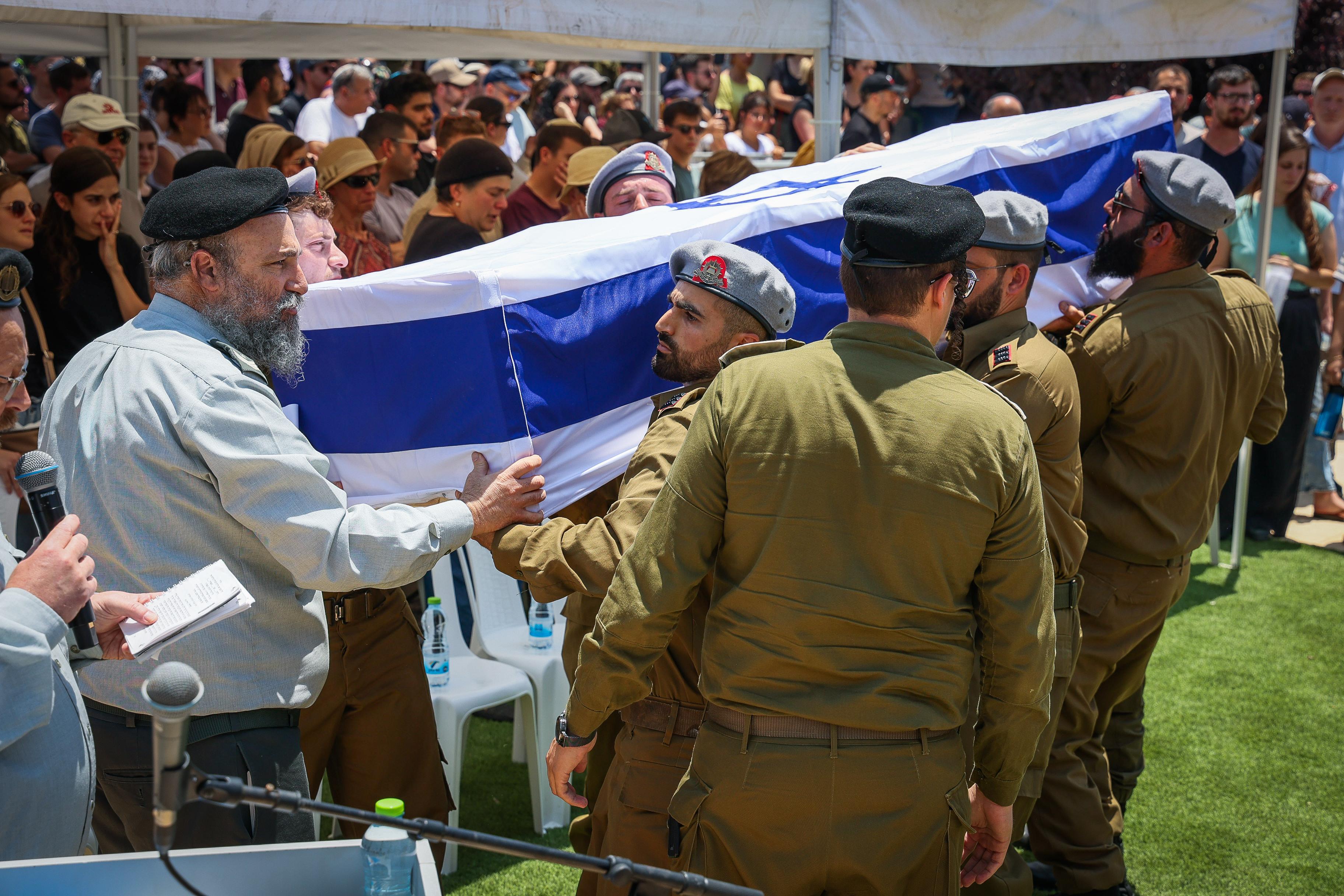 Friends and family attend the funeral of Israeli soldier Captain res. Tal Movshovitz at the military cemetery in Modi'in June 17, 2025. Friends and family attend the funeral of Israeli soldier Captain res. Tal Movshovitz at the military cemetery in Modi'in June 17, 2025.