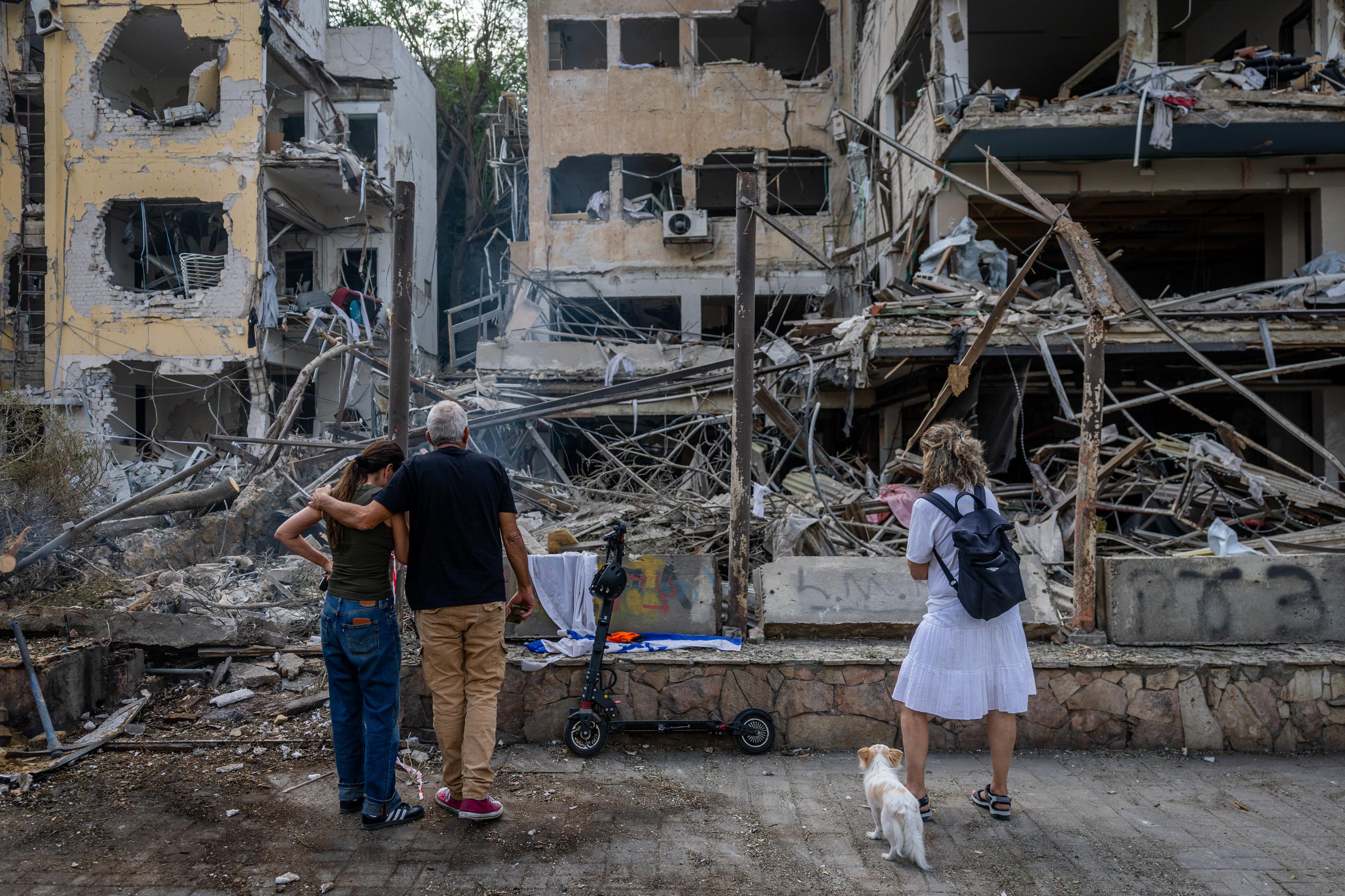 Israeli security and rescue forces at the scene where a ballistic missile fired from Iran hit and caused damage in Tel Aviv, June 16, 2025.