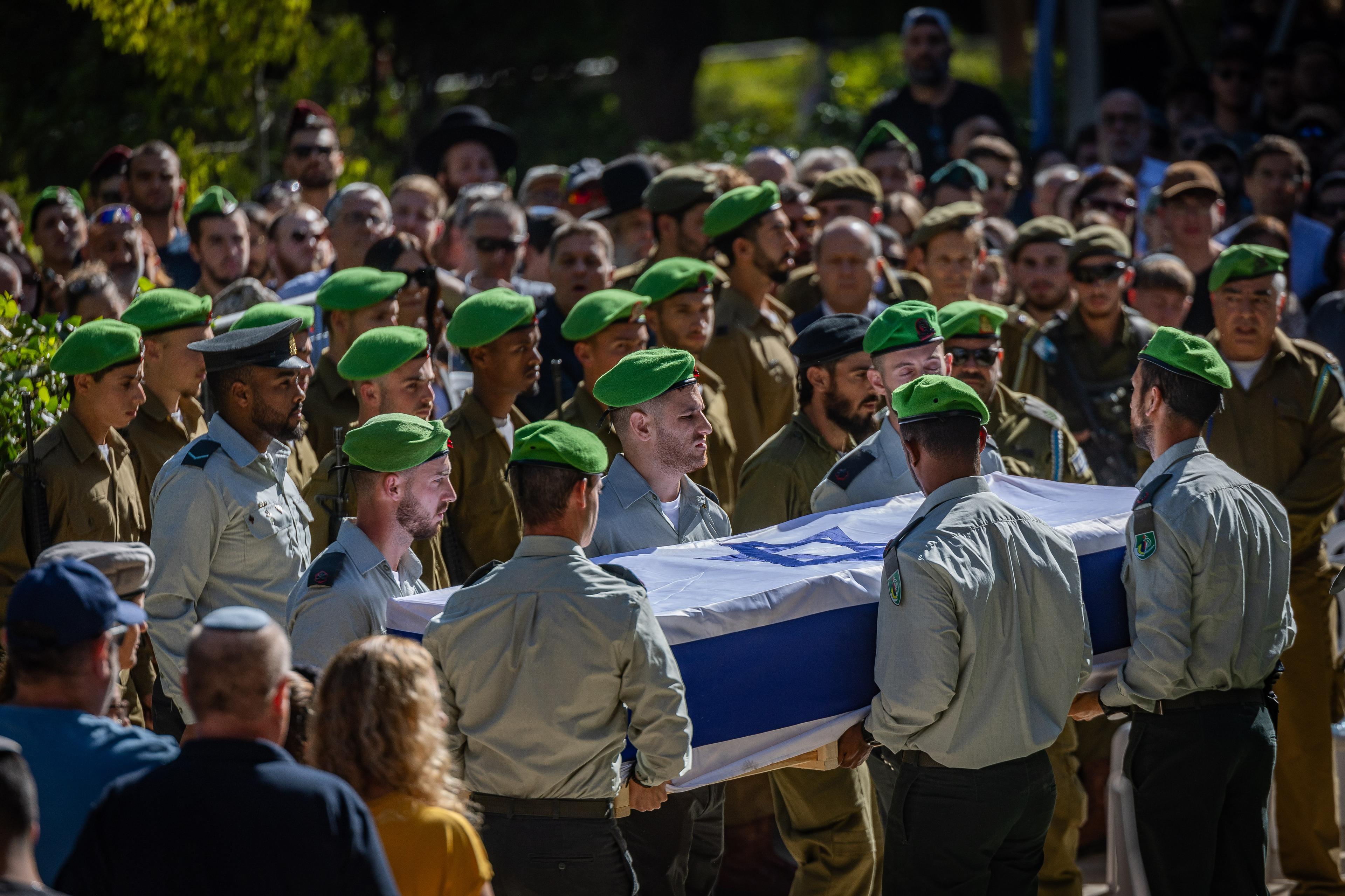 Family and friends attend the funeral of Major Yaniv Kula at Mount Herzl Military Cemetery in Jerusalem, October 20, 2025.