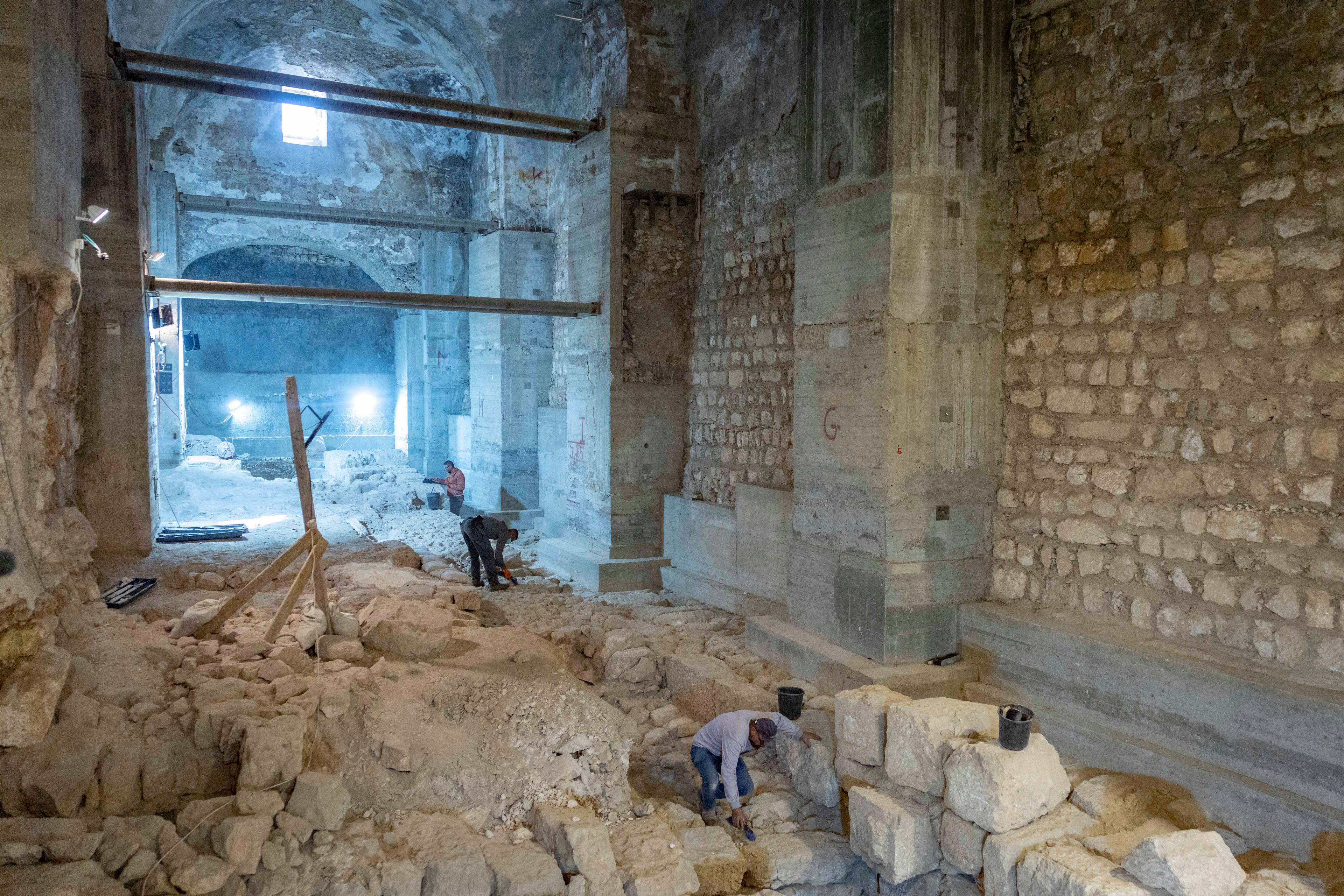 Workers at an excavation in the Kishle at the Tower of David Museum in Jerusalem’s Old City, where an impressive section of the city’s Hasmonean wall was uncovered during an Israel Antiquities Authority excavation, December 8, 2025.