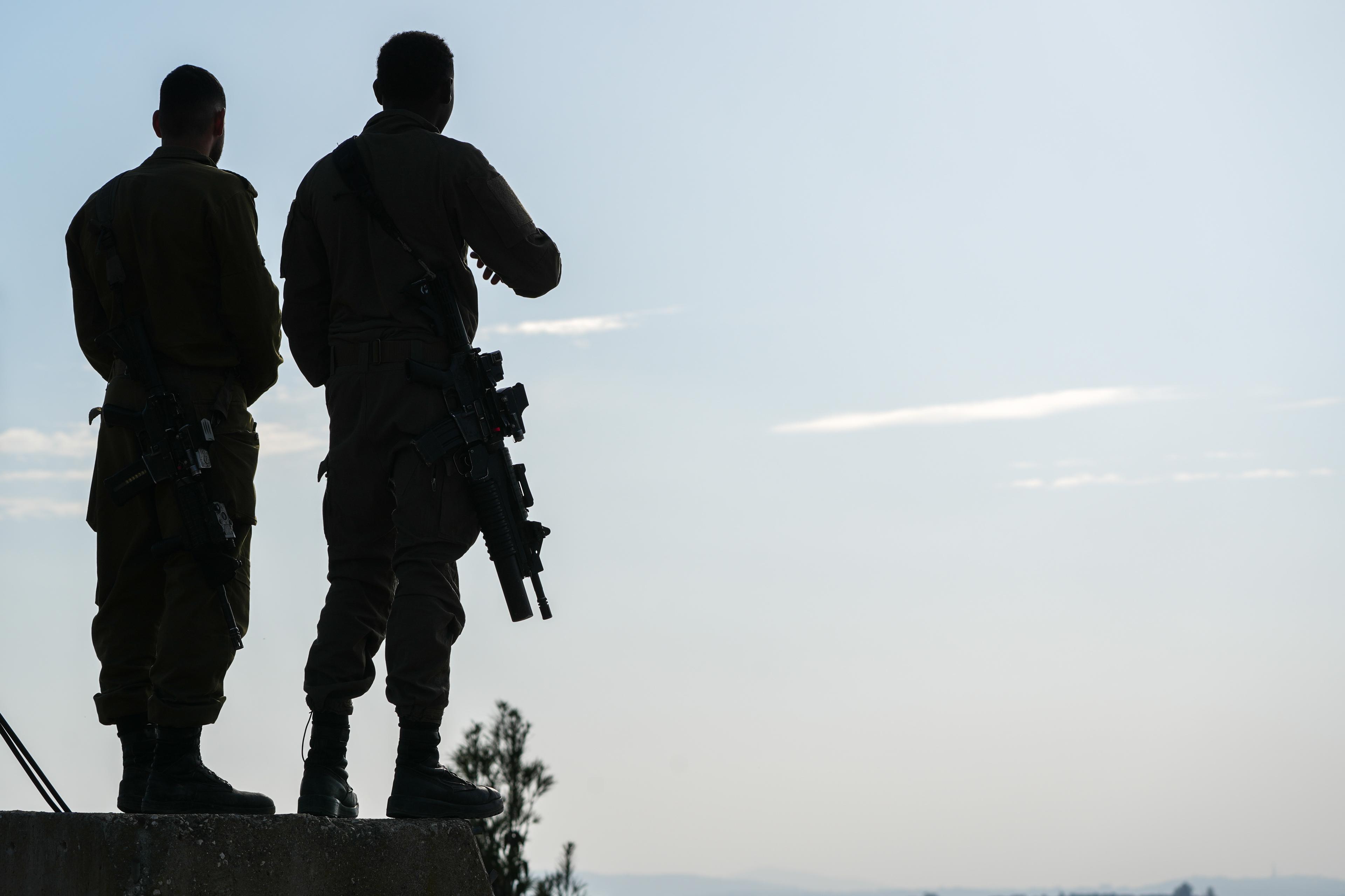 Israeli soldiers stand near the border with Lebanon in northern Israel, December 4, 2025.