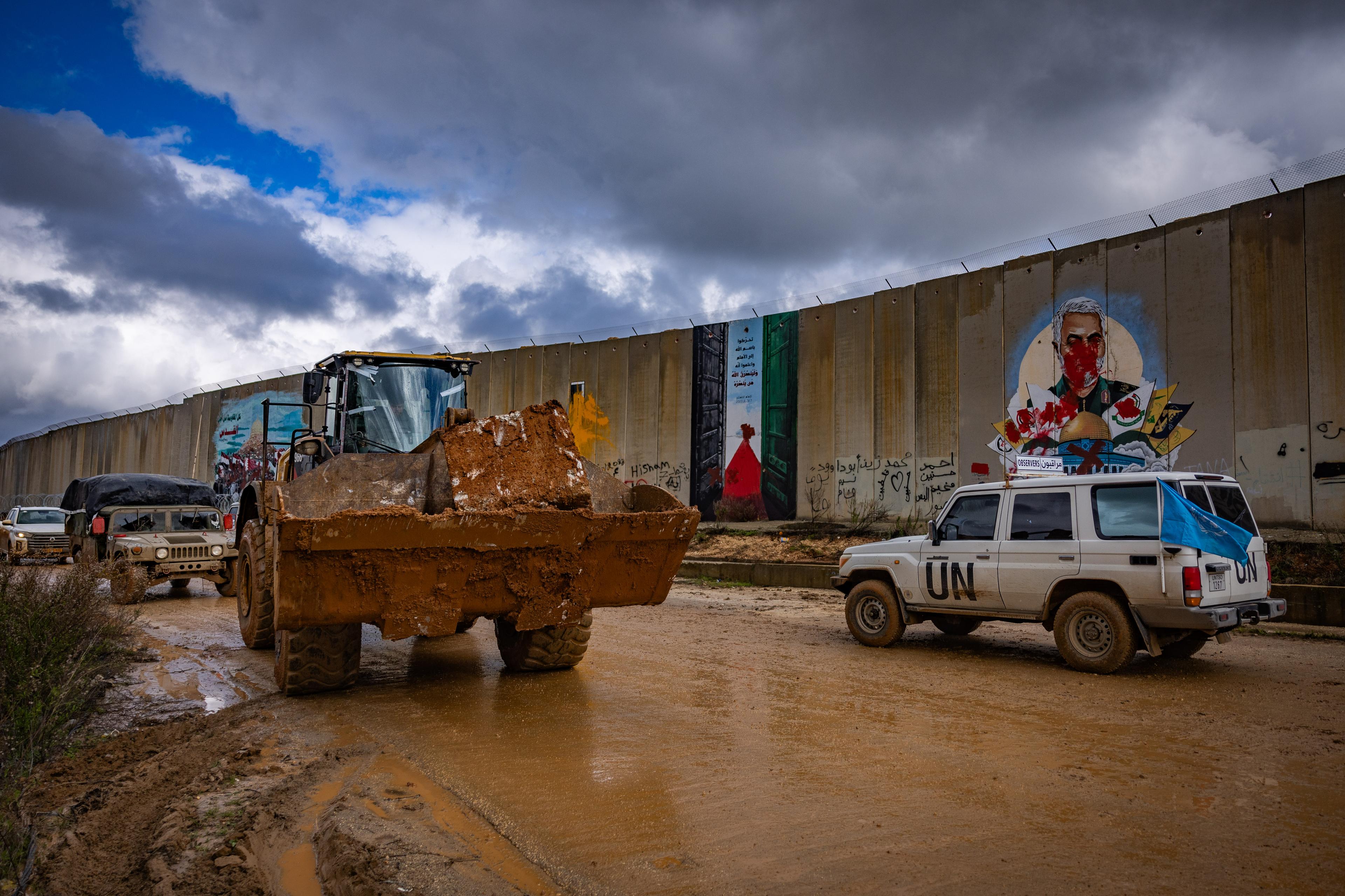 Israeli soldiers working on the Lebanese border fence with Israel in Kfarkela, in southern Lebanon, February 13, 2025.