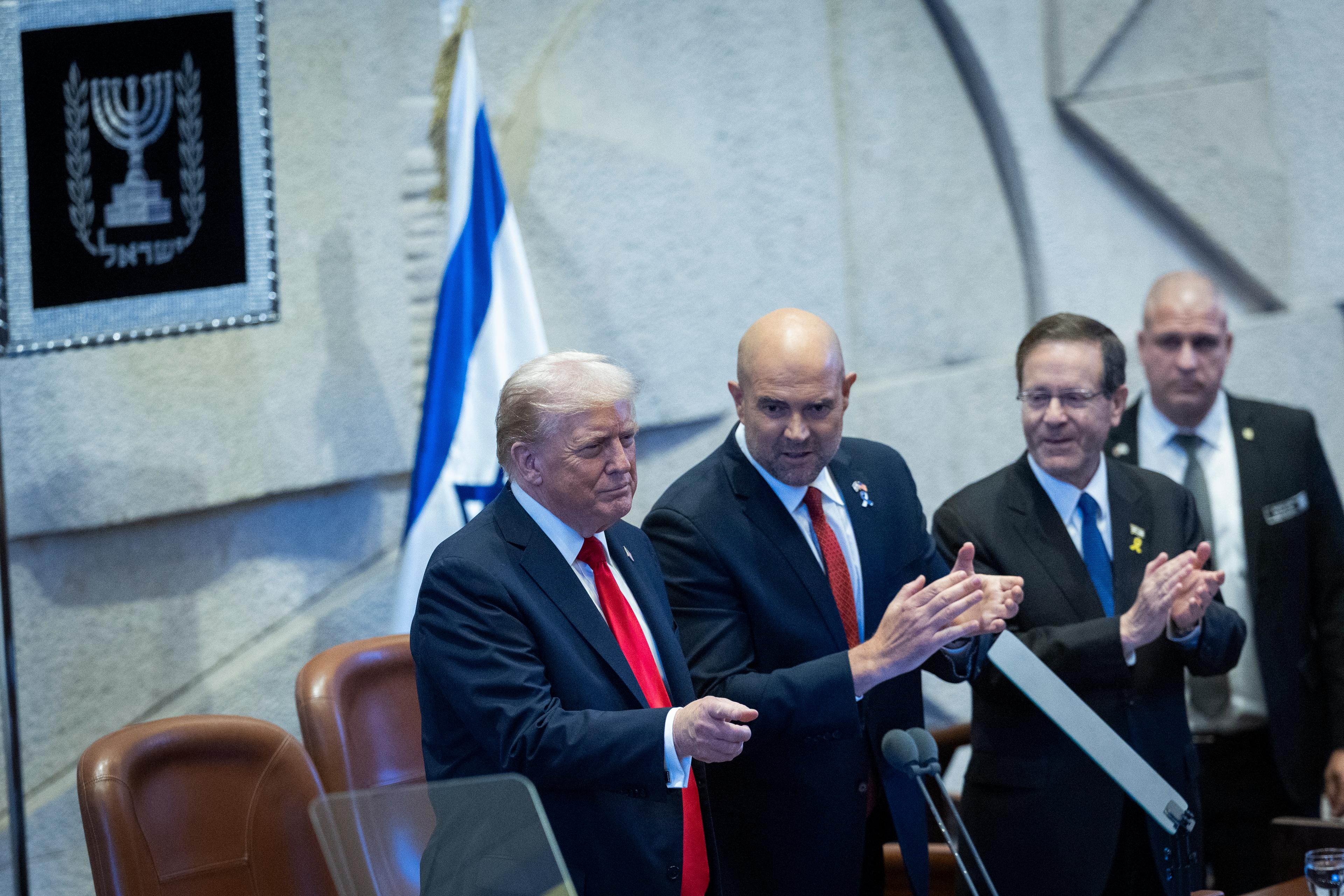U.S. President Donald Trump, Israeli President Isaac Herzog and Knesset speaker Amir Ohana arrive for a special plenum session in honor of President Trump at the Knesset, Israel’s parliament in Jerusalem, on October 13, 2025.