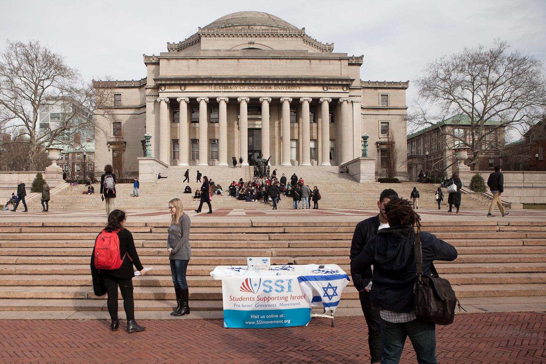 An American student hands out flyers for 'SSI' the Students Supporting Israel Movement, outside Columbia University library in New York City, on February 4, 2016.
