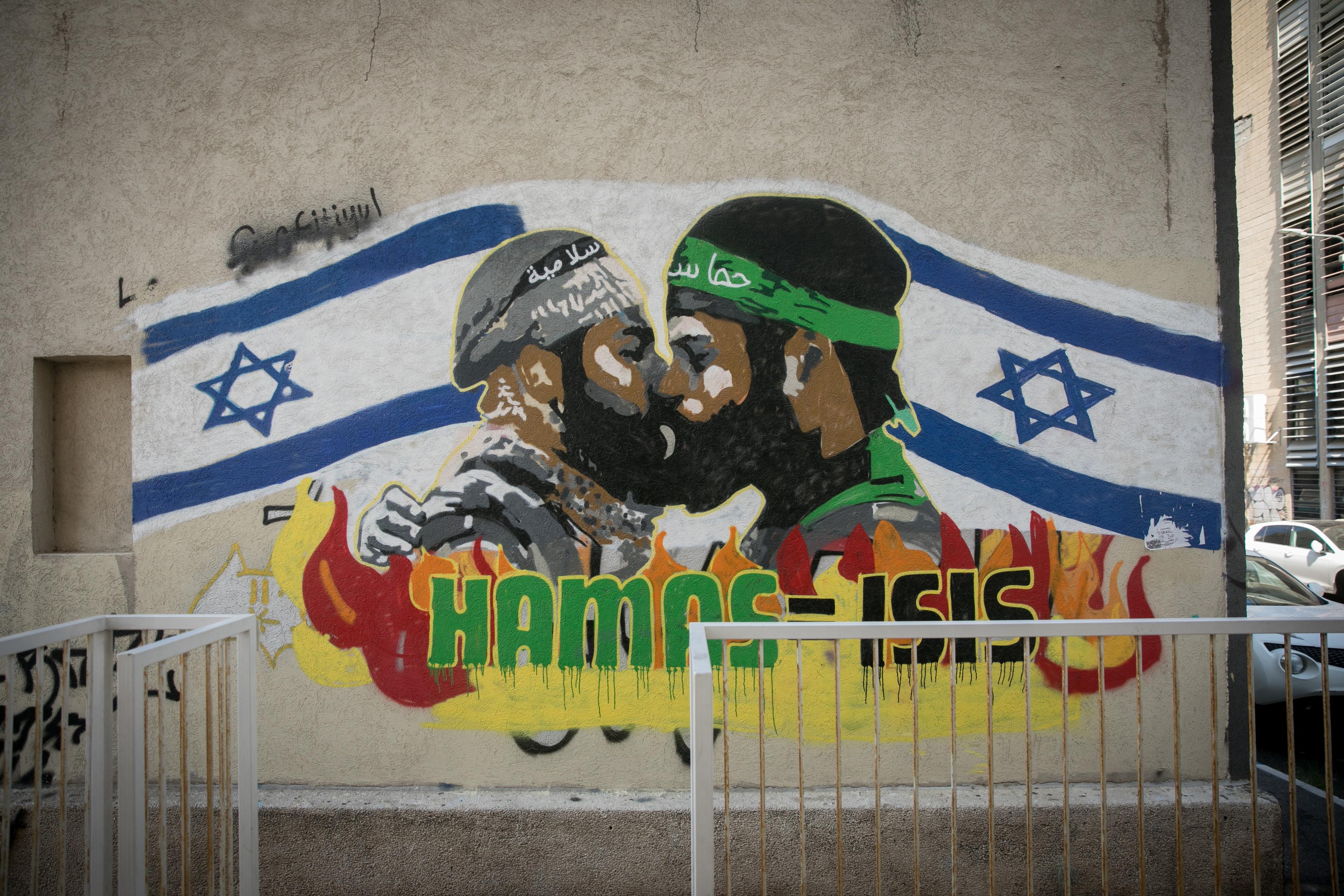 Grafitti showing a Hamas and an Isis member kissing, in south Tel Aviv. September 29, 2024. 