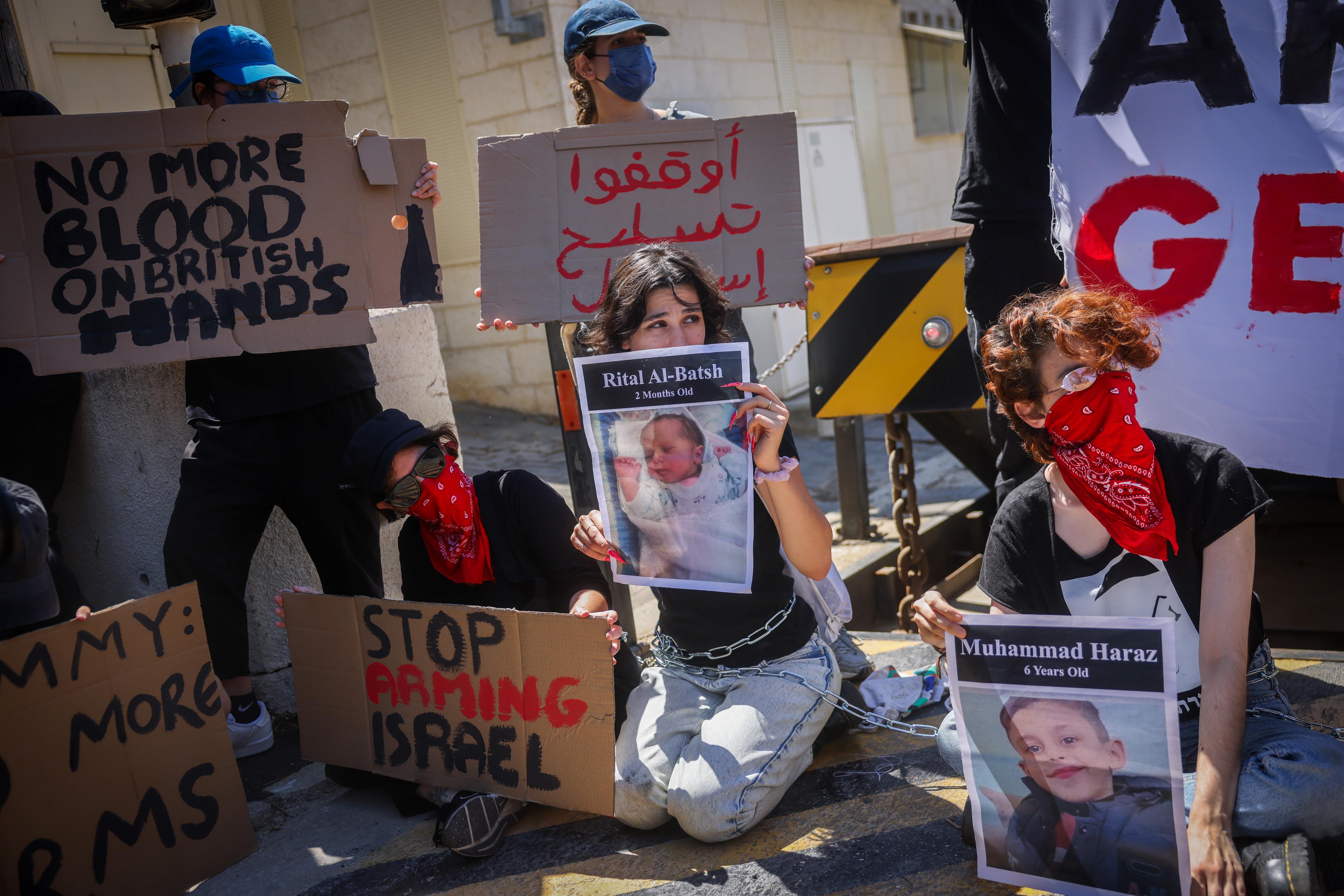 Left wing activists protest against the war, calling for ceasefire at the war in Gaza, outside the British consulate in Jerusalem, August 16, 2024.