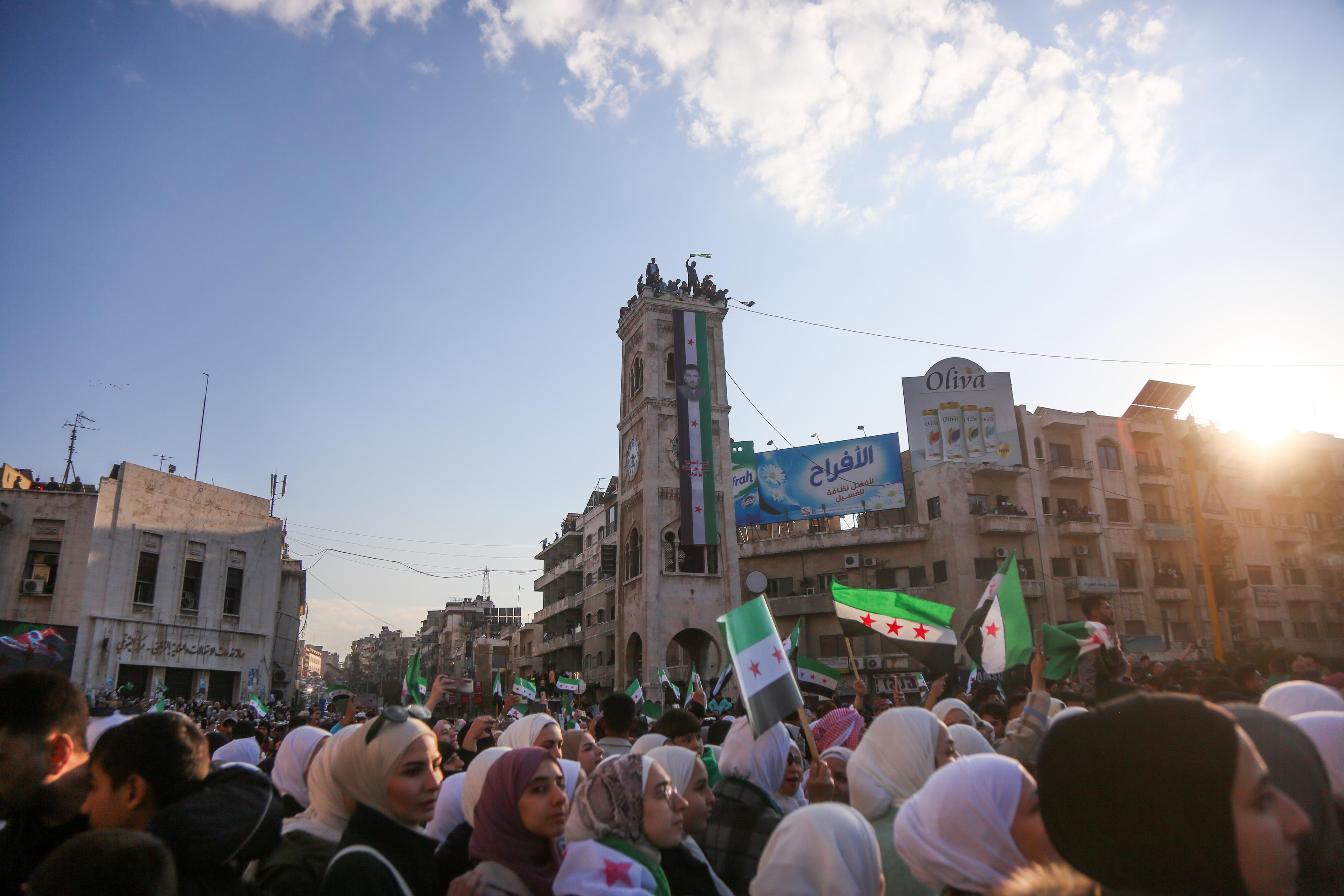 People celebrate the end of the Assad regime after Friday prayers in Hama, Syria, December 13, 2024.