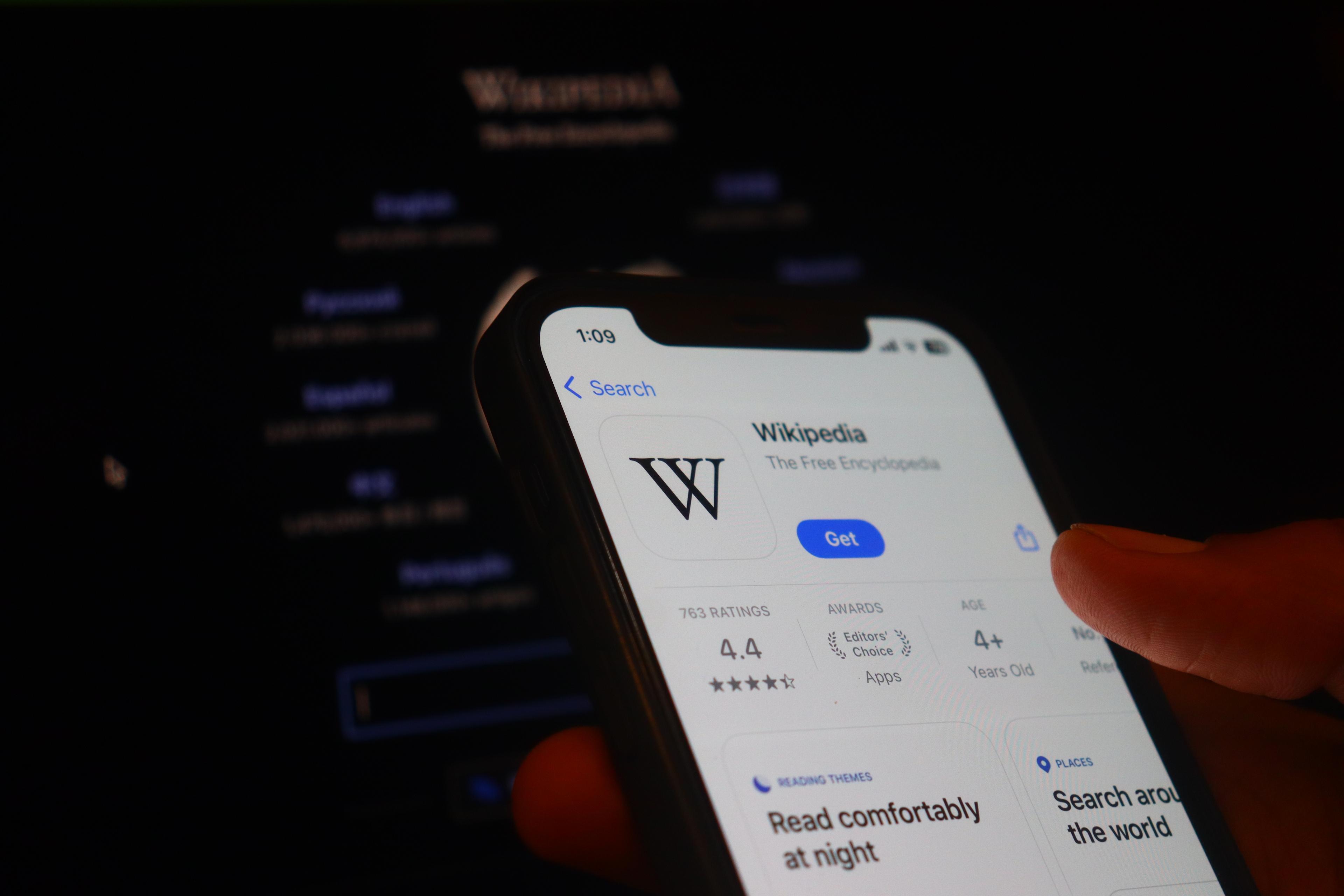 Hand holding iphone with Wikipedia app.Wikipedia is owned and operated by the Wikimedia Foundation, a non-profit organization. New Delhi, India, 20 May 2025