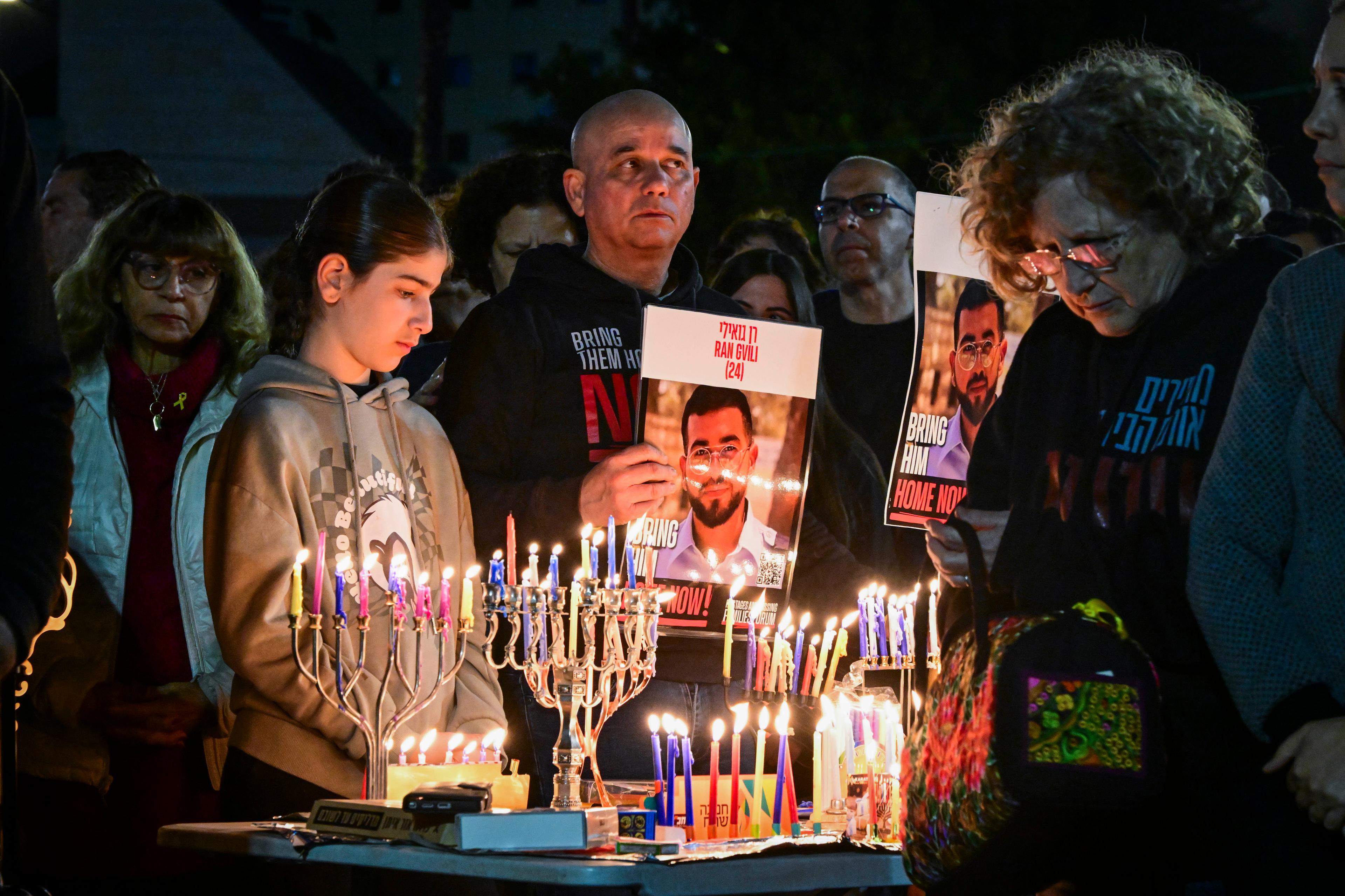 Relatives, friends and supporters of Master Sgt. Ran Gvili, whose body is held by Hamas, attend the lighting of Hanukkah candles at Hostage Square in Tel Aviv, December 21, 2025.
