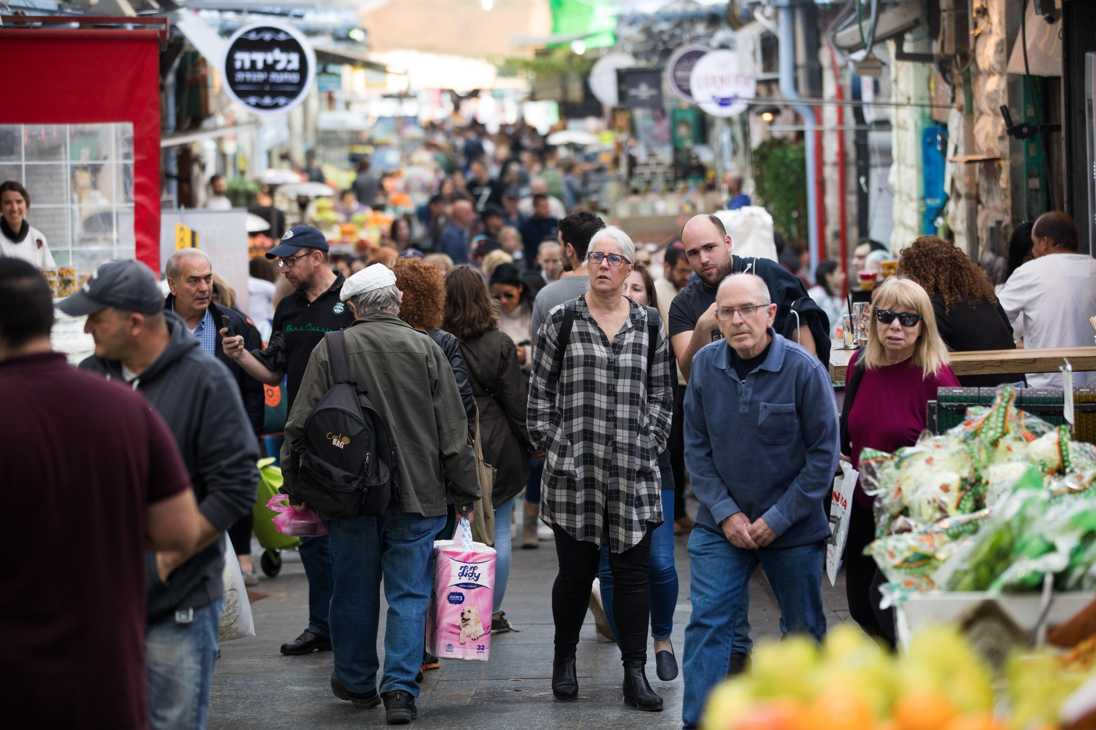 People enjoy at the Mahane Yehuda market in Jerusalem, February 5, 2018.