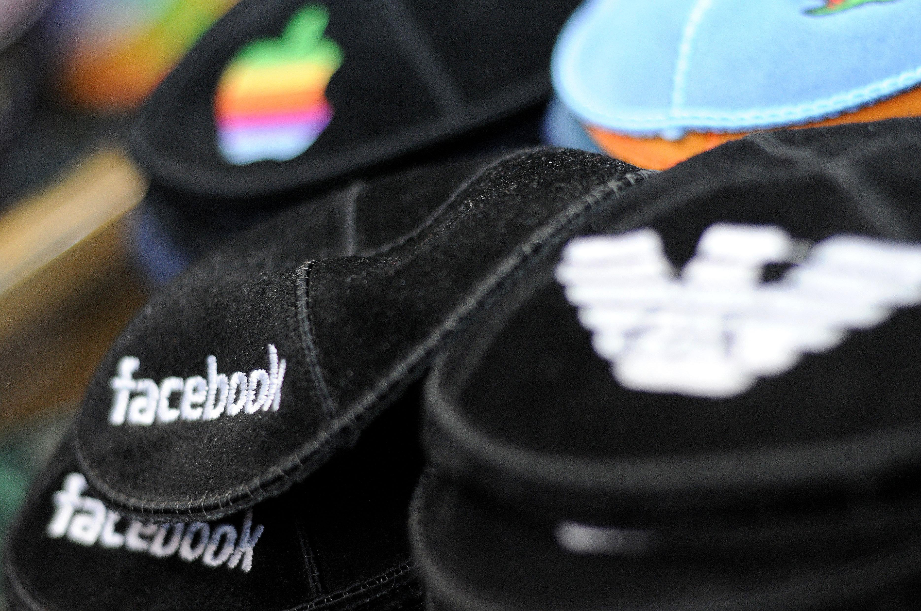 American brands including Facebook, Apple and Emporio Armarni on black kippot, in a Judaica shop on Ben Yehuda Street. March 10, 2011.