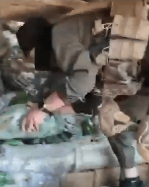 Julani's forces seizing weapons.