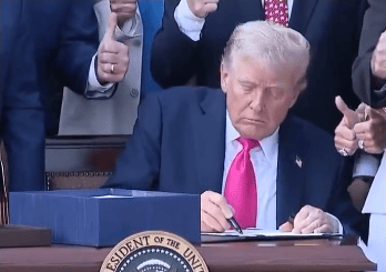Signing the bill.