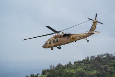 A Military helicopter evacuates injured people from the Ziv Medical Center in Tzfat, after being injured, February 14, 2024. 
