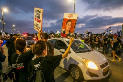 Demonstrators protest near the house of Israeli Prime Minister Benjamin Netanyahu in Caesarea, June 27, 2024. 