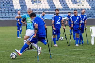 Israel's national amputee soccer team, some injured in the recent war playing during a friendly match, Teddy Stadium, Jerusalem, May 29, 2024.