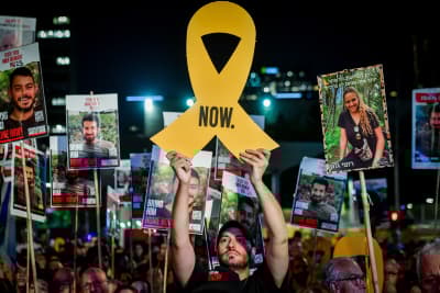  Israelis attend a rally calling for the release of Israelis held hostage by Hamas terrorists in Gaza, at "Hostage Square" in Tel Aviv, July 20, 2024