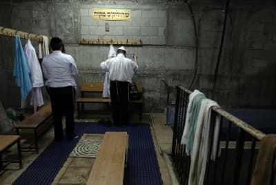 A Haredi man is seen at the "mikve" (ritual bath)