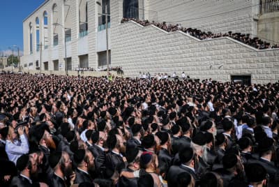 Ultra-Orthodox Jewish men attend the wedding of Rabbi Yaakov Aryeh Alter's granddaughter in Jerusalem on June 6, 2023 